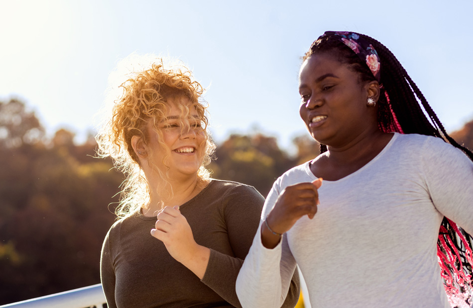 Two people jogging together outdoors