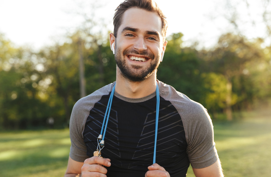 Person exercising outdoors with jump rope