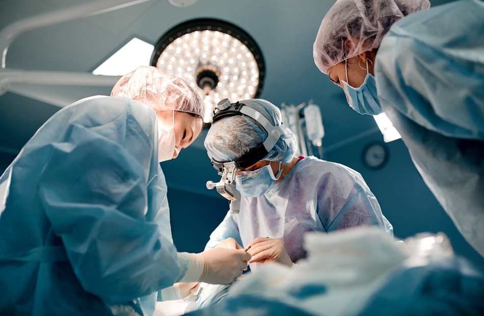 Surgical team performing procedure in operating room