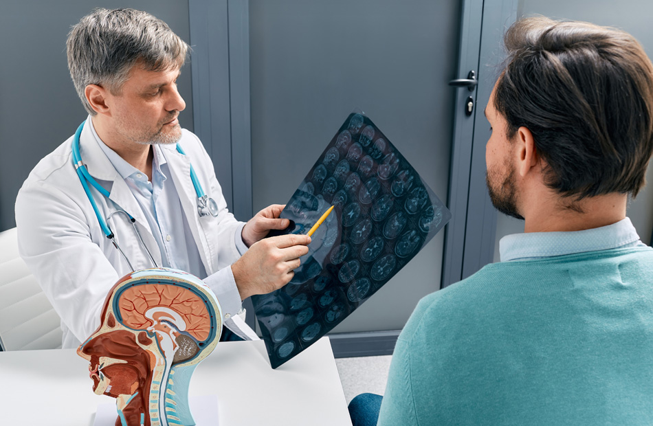 Radiologist reviewing brain scan results with a patient