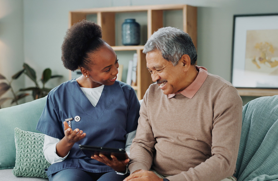 Doctor and patient looking at a tablet together