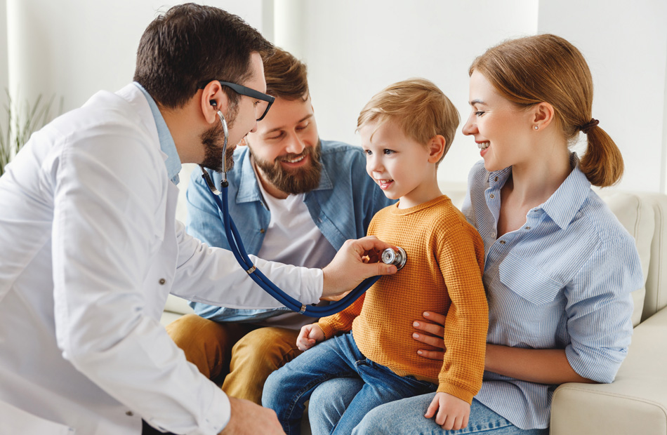Doctor examining child with stethoscope while parents sit nearby