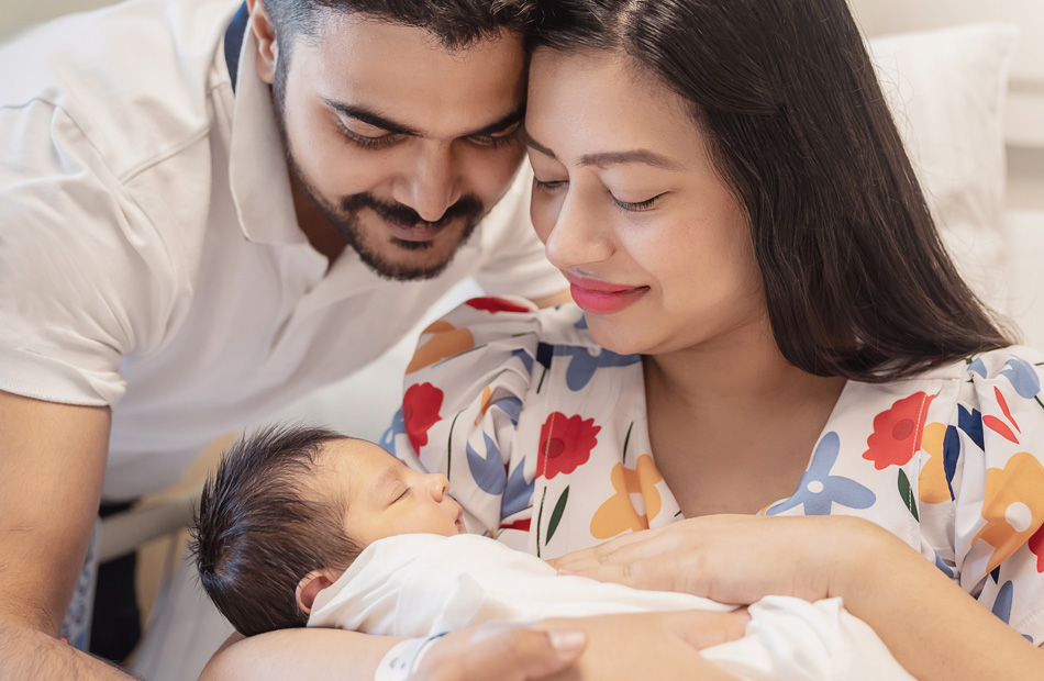 Parents holding their newborn baby