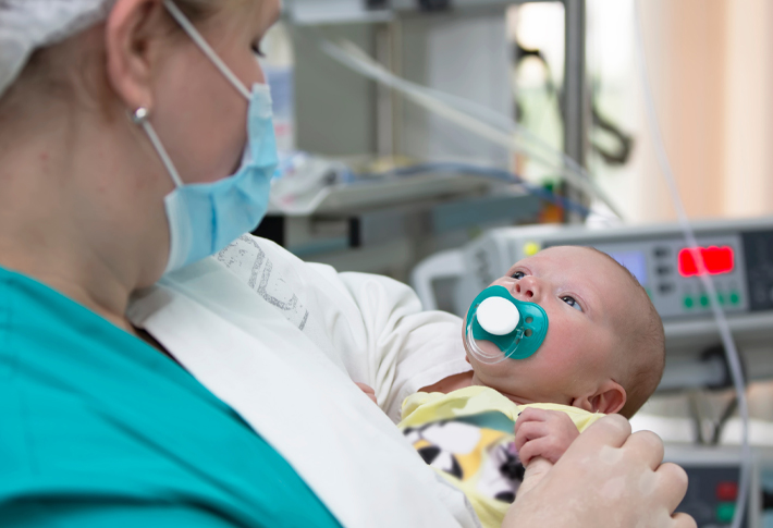 Doctor holding baby