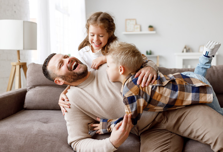 Family having fun together in a living room