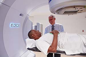 Doctor assisting a patient during a scan